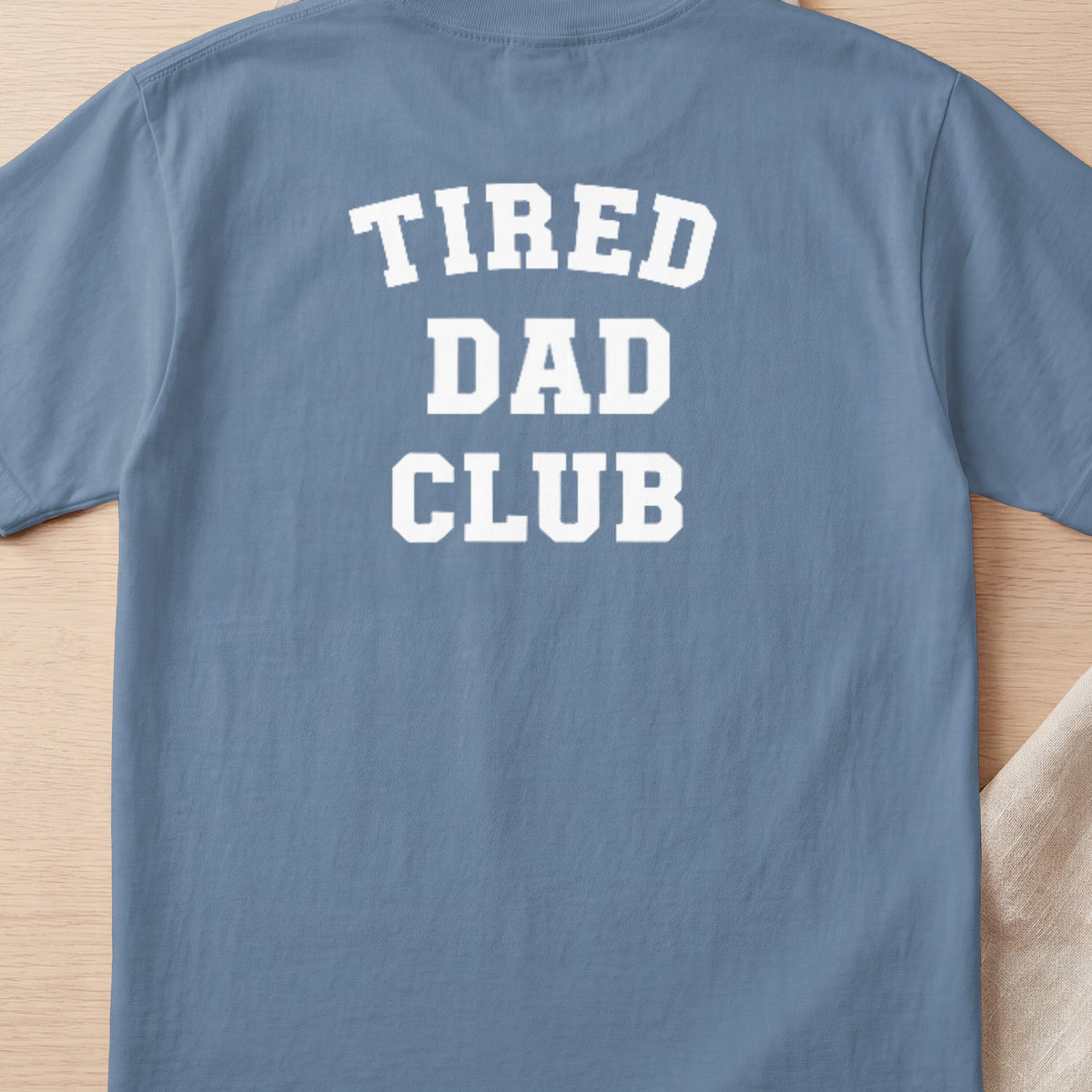 Blue t-shirt with white text reading "TIRED DAD CLUB"