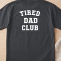 Dark grey t-shirt with white text reading "TIRED DAD CLUB".